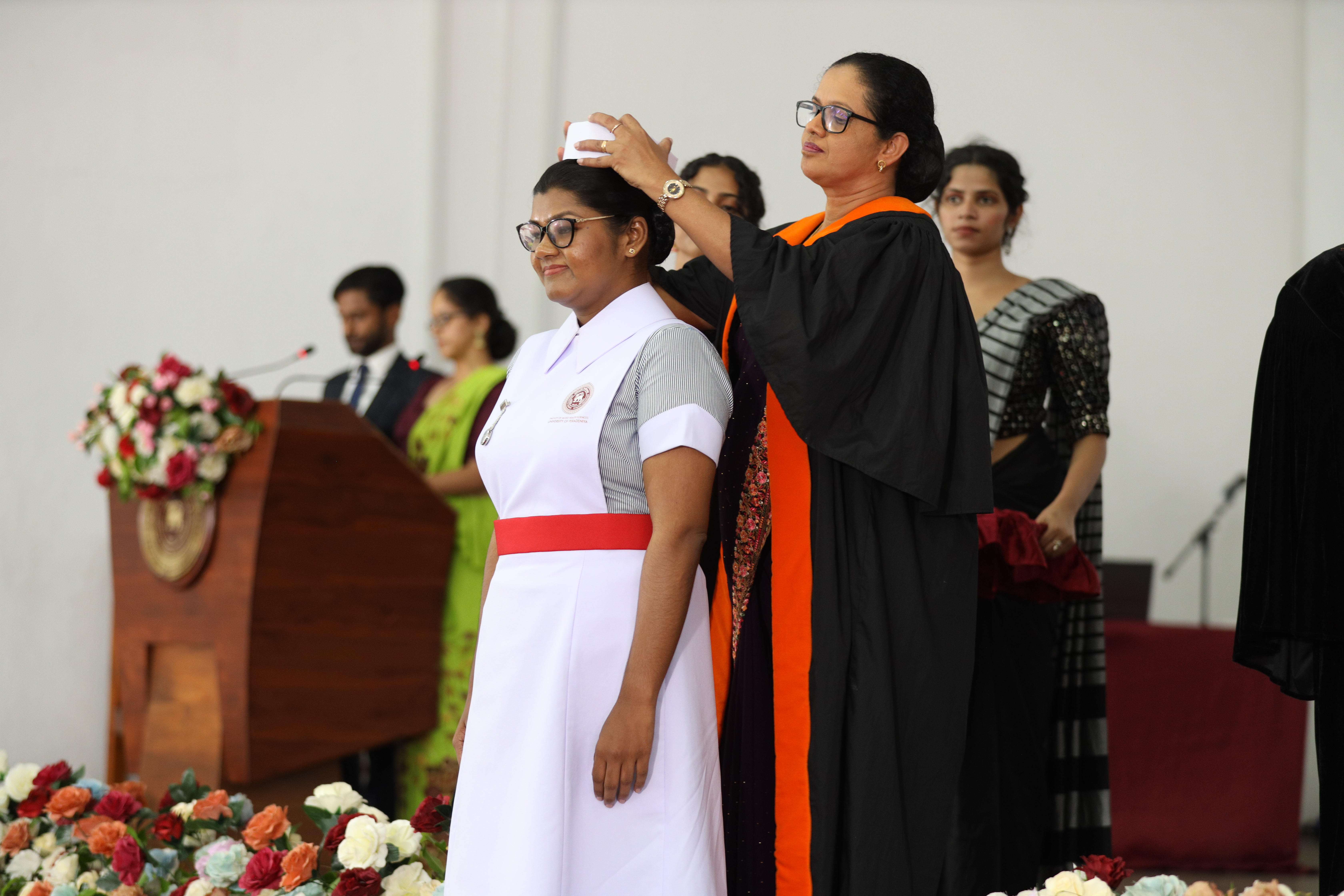 Students receiving nursing caps and lamps